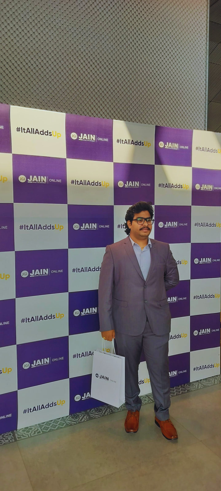 Venkatesh Kadali at the graduation ceremony backdrop
