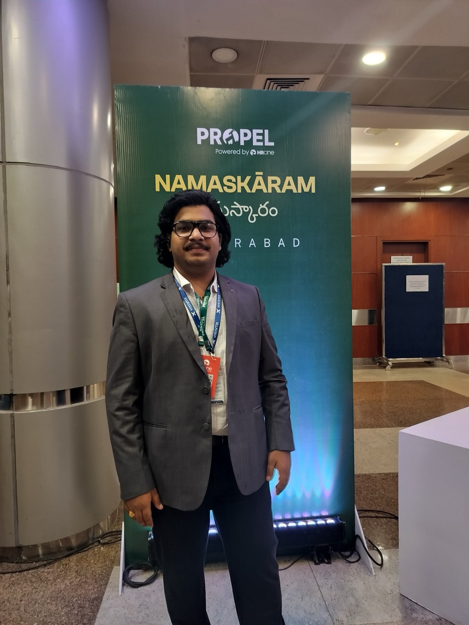 Venkatesh Kadali at the ProPEL Namaskāram Hyderabad welcome standee