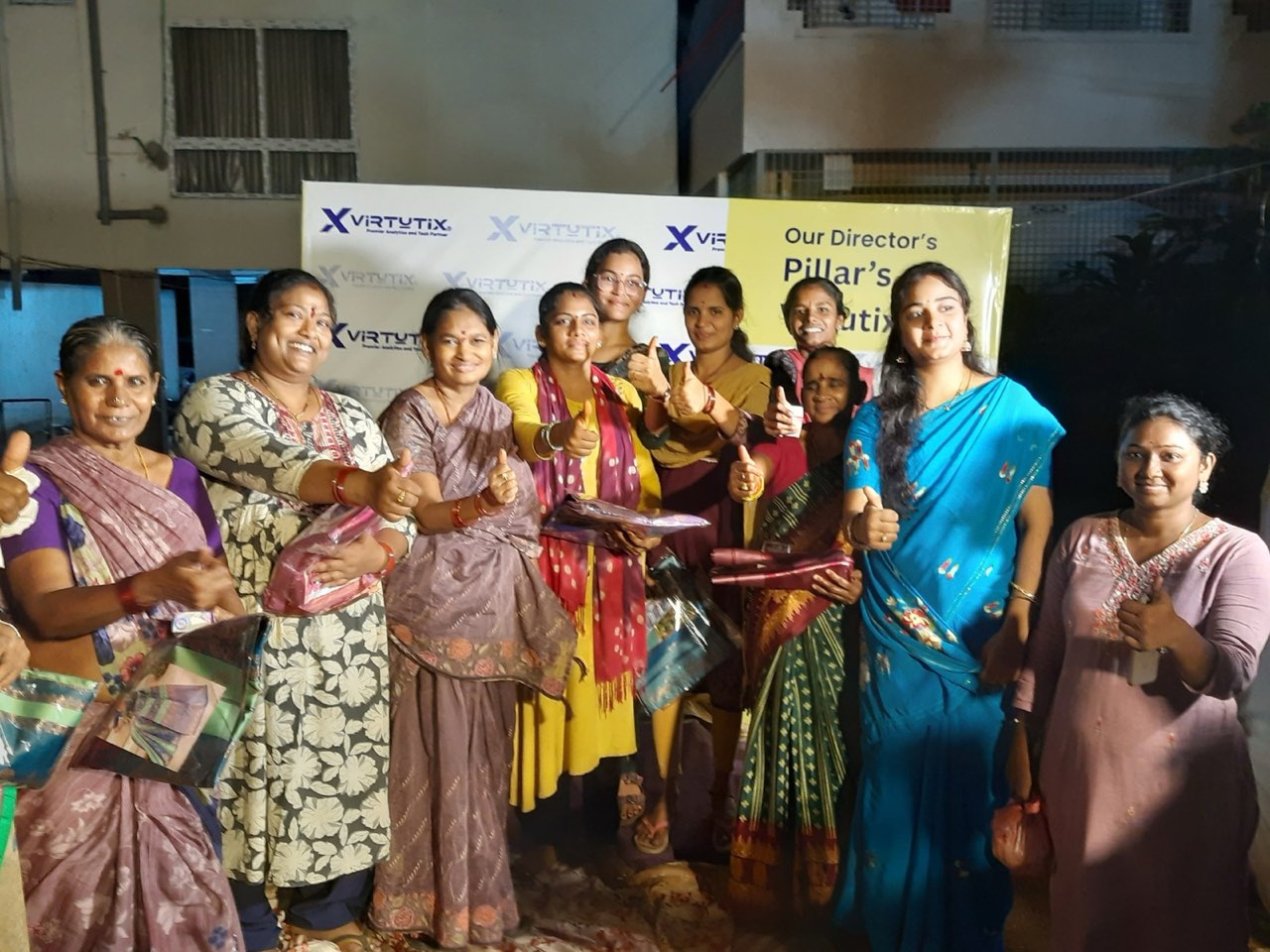 Women from the community with their gifts after the Kumkuma Puja