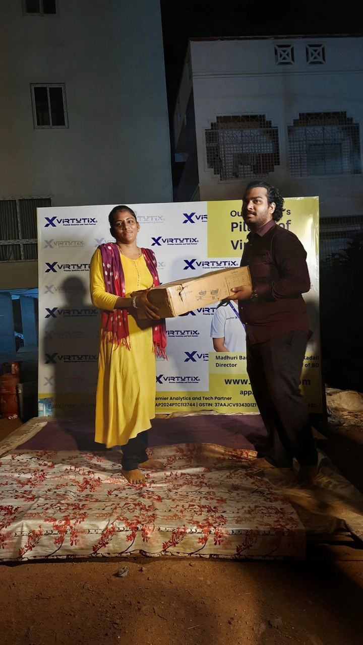A participant receiving a gift at night