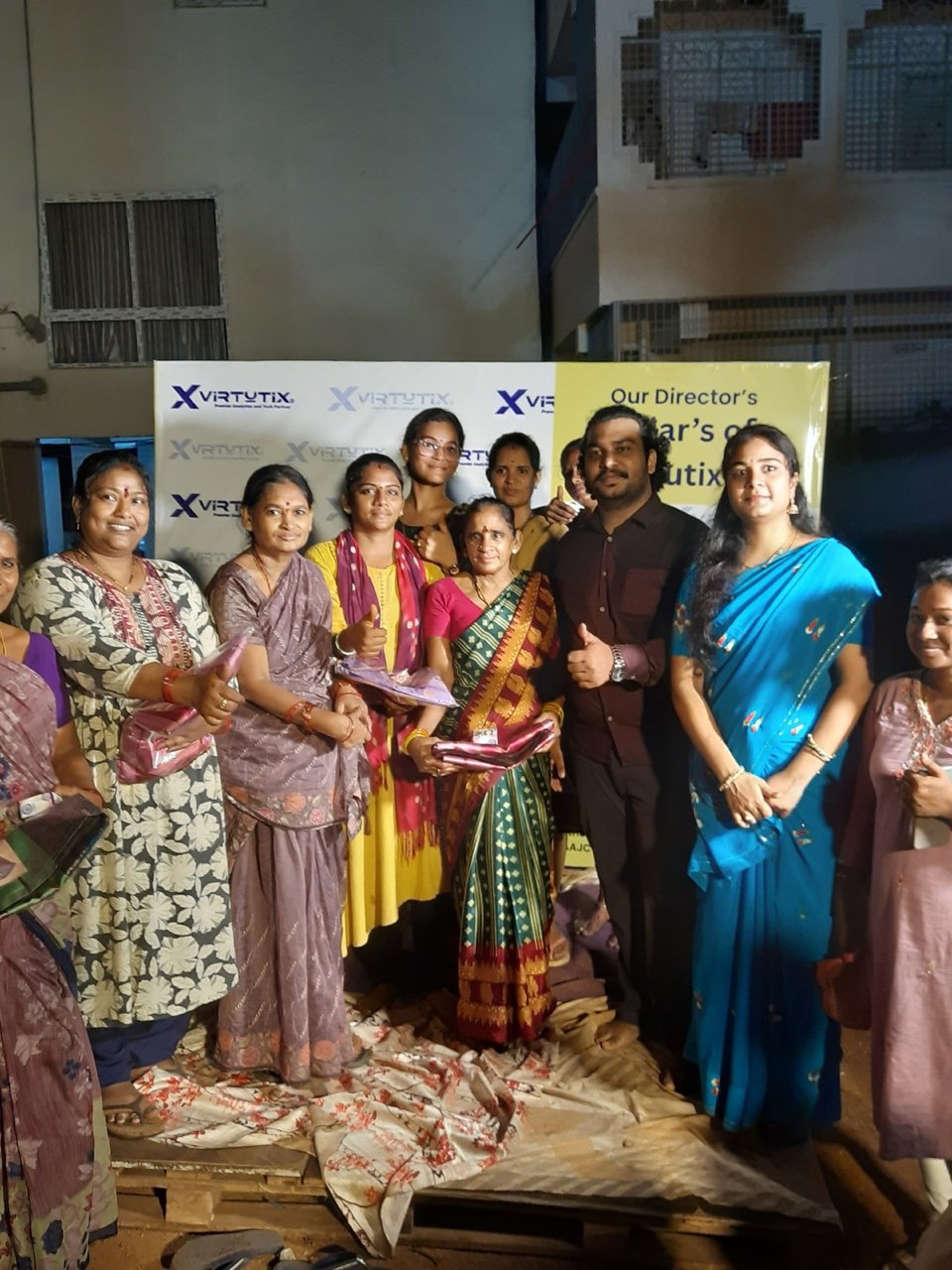 Women from the community with their gifts