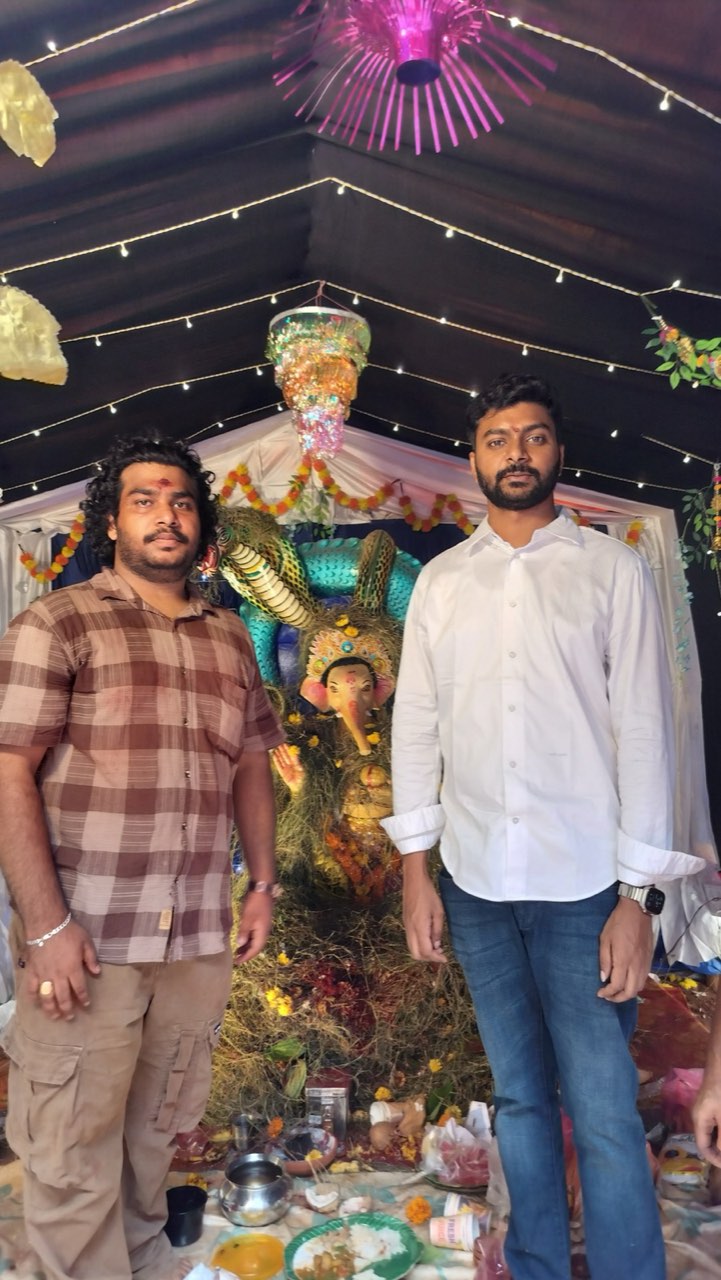 Mourya Simha, son of MLA Gana Babu, with Kadali Venkatesh at the pandal