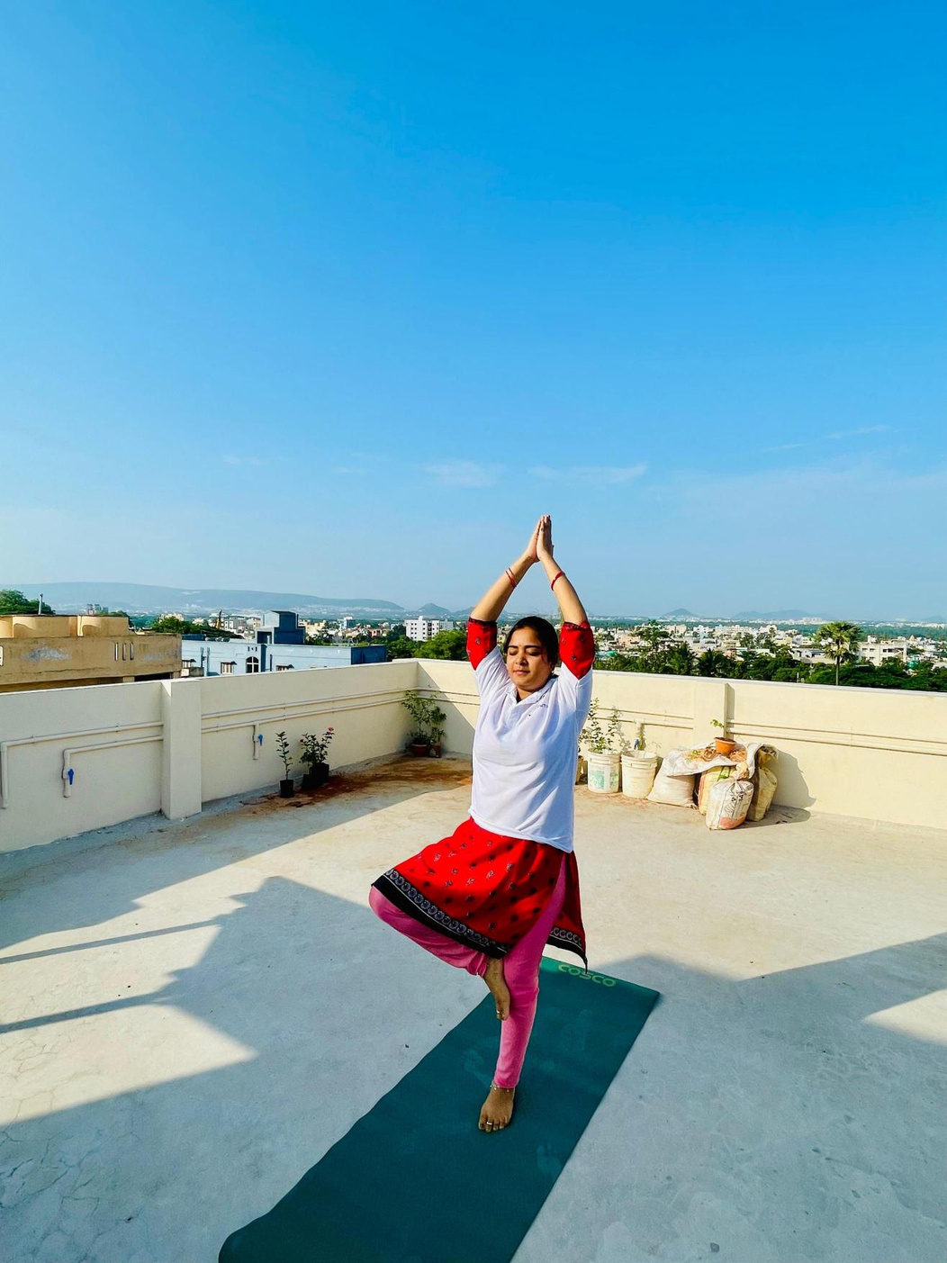 A yoga pose on the rooftop