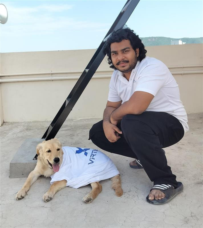 Venkatesh Kadali with Mr. Rinkel, the office dog